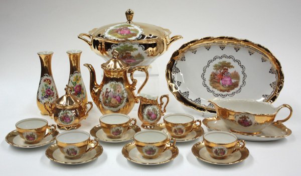 Bavarian porcelain dinnerware: (lot of 20) Set of Bavarian porcelain, with gilt and polychrome decoration, marked ''J. K. W. Bavaria Western Germany'' including teapot, creamer, sugar bowl, a pair of bud vases, six cups with matchi