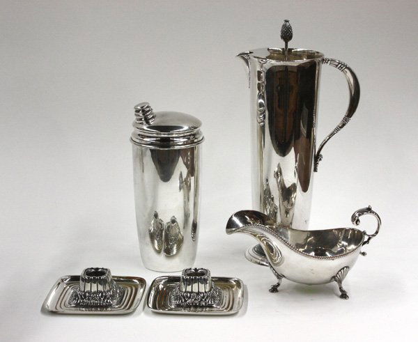 silverplate cocktail shaker & gravy: (lot of 5) Selection of silverplated items including a gravy boat with acanthus leaf handle and shell knees, a Wallace cocktail shaker, and International Silver Co. Tropical pattern iced tea pitcher a