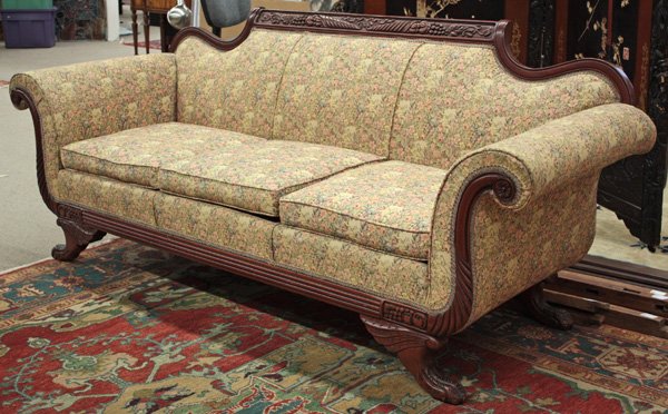 American Late Classical style sofa: American Late Classical style three cushion sofa, circa 1940, with cornucopia crest rail and arms ending in rosettes, above plume knees and claw feet, upholstered in floral tapestry fabric, 34.5''h x 