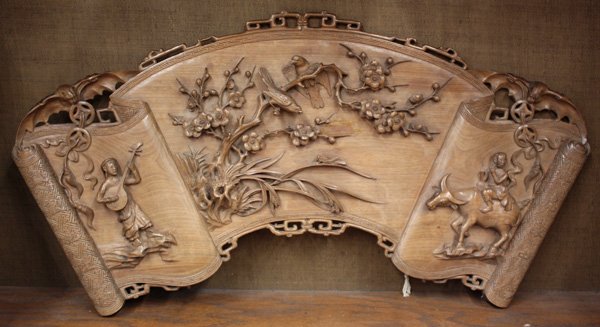 Asian Carved Wood Wall Panel, Vietnam: Asian carved wood panel, possibly Vietnamese, fashioned as an unfurled scroll in a fan-like configuration and centered by a high relief carving of birds on a flowering branch flanked by a musician and
