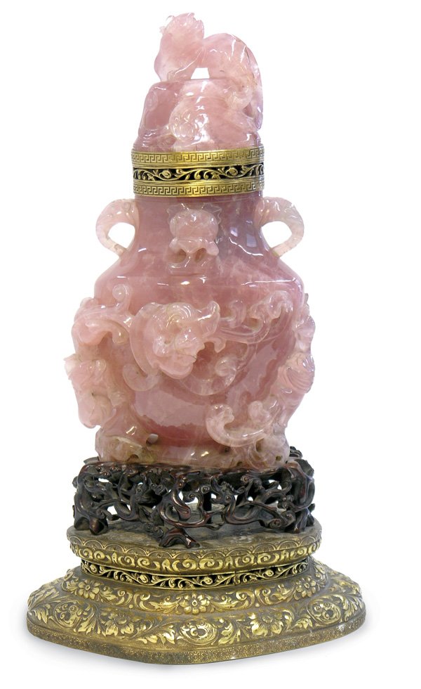 Chinese Large Rose Quartz Covered Urn: Chinese large rose quartz urn with Western gilt metal fittings, the slightly flattened ovoid body carved in high relief with a pair of phoenix amid flowering bushes, a pair of elephant-head handles at