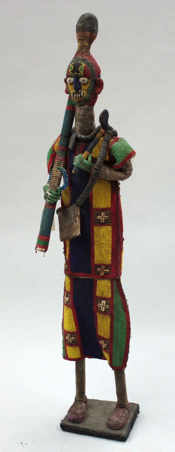 Horse hair fly swatter, Yoruba Nigeria: (lot of 3) Horse hair fly swatter, Yoruba tribe, Nigeria, having a beaded base and handle decorated with masks, the whip from a rich, black mane, 36''l, together with two ceremonial fetish articles, W