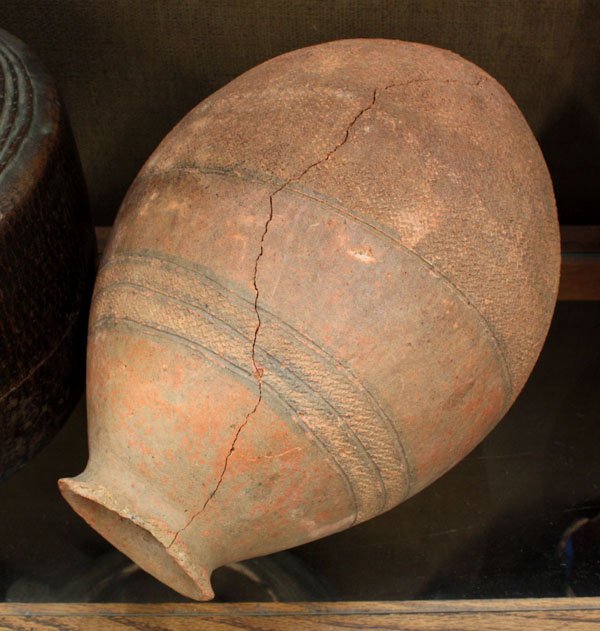 Old ceramic pot, Africa: (lot of 2) Old ceramic pot, Africa, in red-orange clay with small, detailed bands of decoration, beehive form, together with a gourd vessel, West Africa, the larger 13''h x 9''d (crack to clay pot, lo