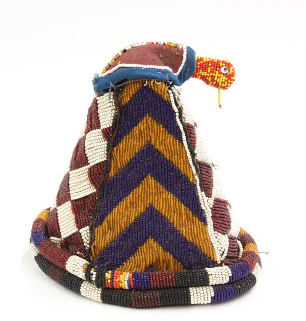 Beaded ceremonial crown Yoruba Nigeria: (lot of 2) Beaded ceremonial crown, Yoruba tribe, Nigeria, with yellow, black and blue patterns and cowrie shell banded edge, showing much wear, 13''h x 11''w x 9''d, together with a beaded ceremonial