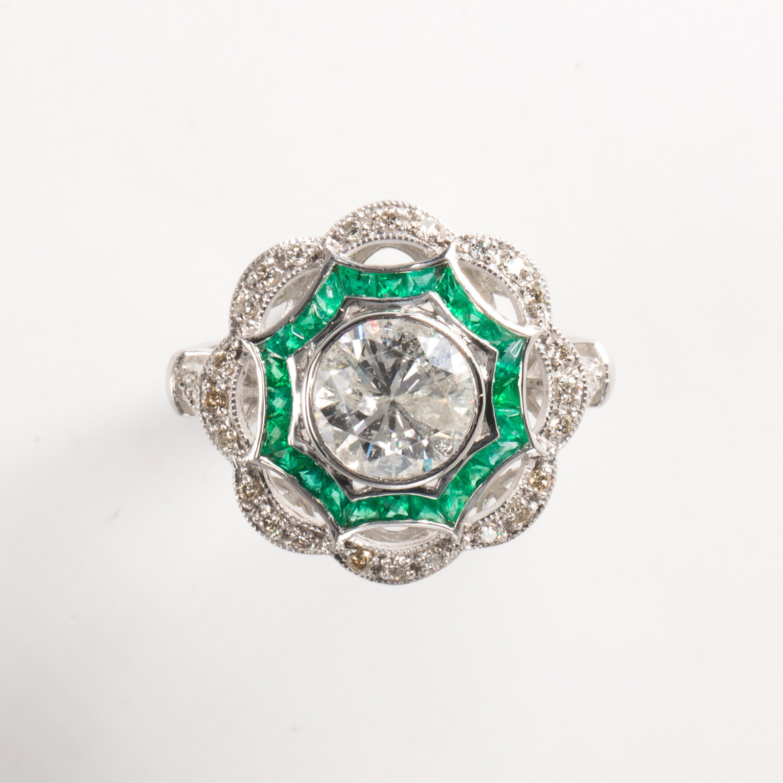 A diamond, emerald and platinum ring (1 of 2)