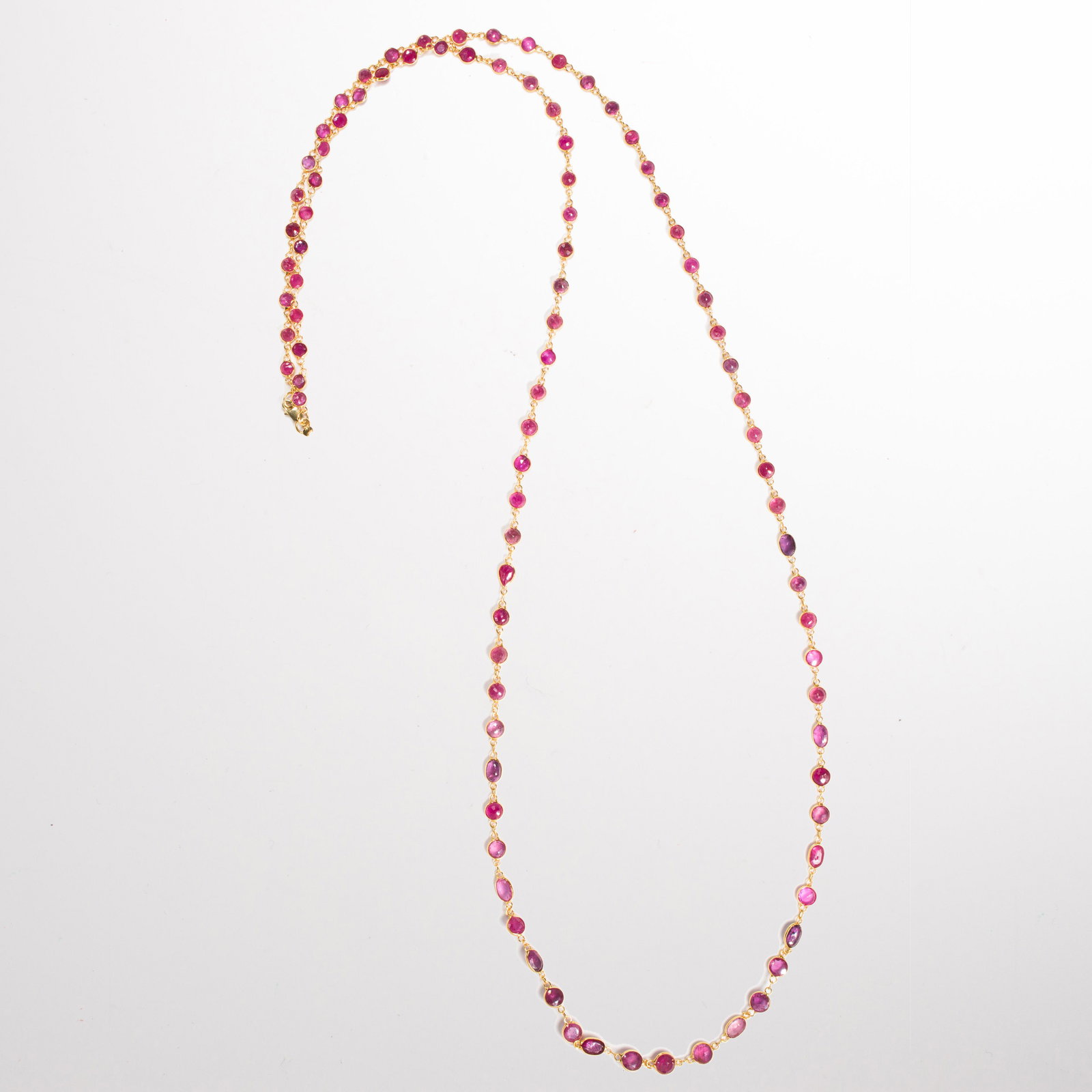 A ruby and eighteen karat gold necklace (1 of 2)