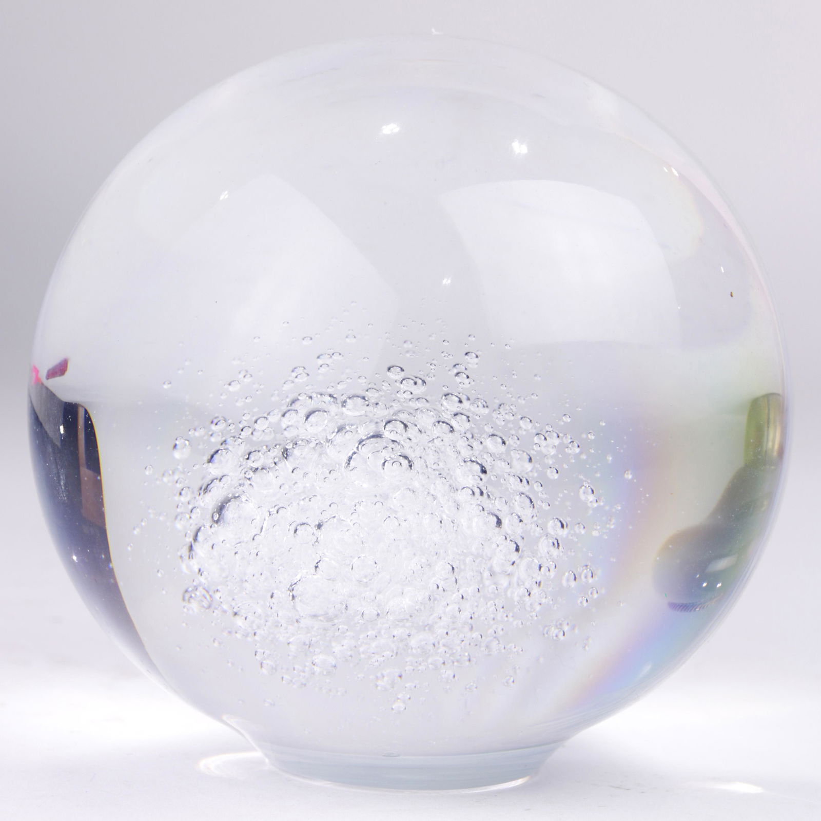 A Bruce Beasley cast lucite sphere: A Bruce Beasley (American, b. 1939) cast lucite sphere, having bubble inclusions, and signed and dated on underside, "Beasley, '73," 5.5"h