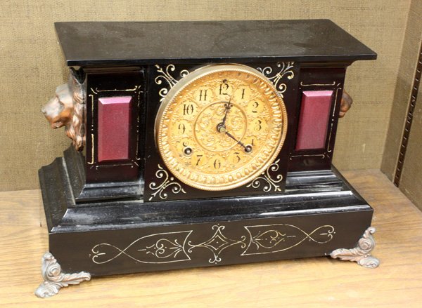 Ansonia ''Venice'' cast iron enameled mantle cloc: Ansonia ''Venice'' cast iron enameled mantle clock with ornate brass dial, arabic numerals, and eight-day time and strike movement, 10.5''h x 16''w x 7''d
