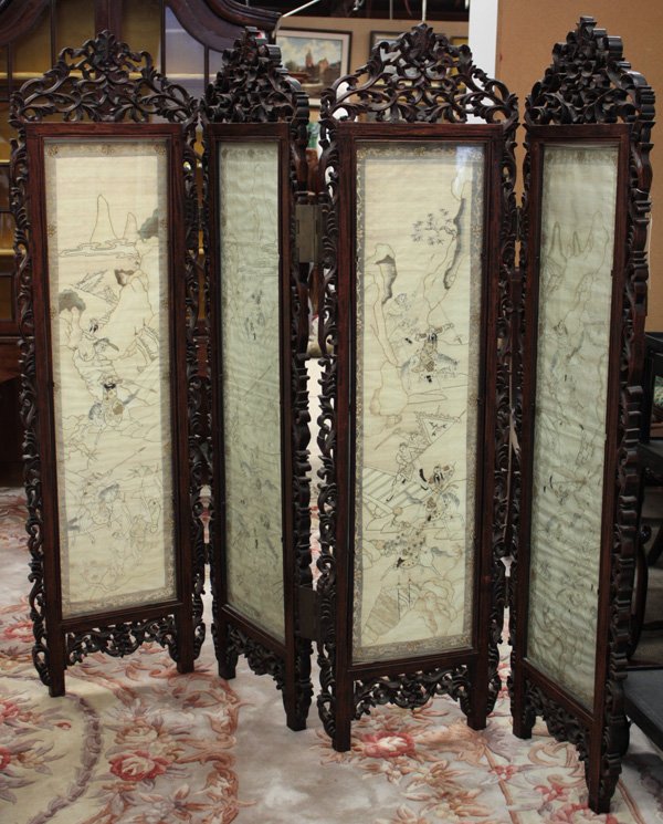 Chinese Kesi Four-Panel Hardwood Screen: Chinese carved hardwood four panel screen with inset silk kesi panels, late 19th/early 20th century, each panel with a silk tapestry panel featuring warriors in a landscape within foliate borders and 