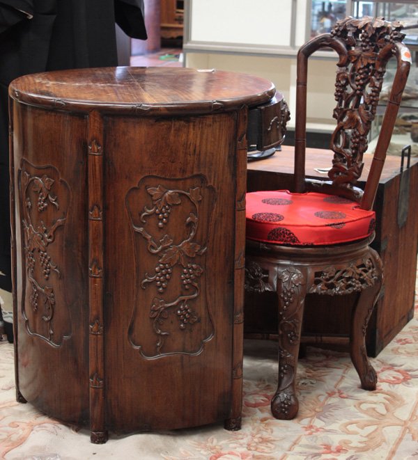 Chinese Export Wood Desk/Chair w/Grapes: (lot of 2) Chinese export carved round desk and matching chair, early 20th century, the desk of unusual circular shape with faux-bamboo edges and a single curved drawer fronted by a high relief carvin
