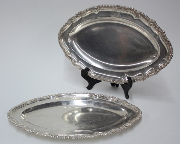 Georgian sterling silver trays, London: Pair of Georgian sterling silver trays, London makers William Burwash and Richard Sibley, made 1806, in cartouche form and bearing an incised coat of arms depicting man and lion and the Blairtyre hous