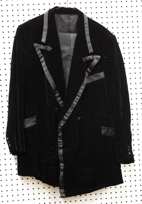 Custom made black velvet tuxedo, Merv Griffin: Custom made black tuxedo, the velvet jacket having satin trim at collar, lapels, and pockets, three button detail at sleeves and double button closure, with matching tuxedo pants and an associated pai