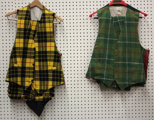 Retro suits, Merv Griffin: (lot of 5) Selection of retro vest and pants sets including green plaid and yellow and black plaid sets. Provenance: The Collection of Tony Griffin - selected items left to him by his father