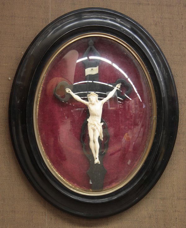 Continental carved ivory Cristo Vio: 19th century Continental carved ivory Cristo Vio, mounted to ebony cross with three-nail, encased in convex glass frame, figure: 6.5''h x 4.5''e; frame size: 18''h x 14''w (loss to two finger tips, ar