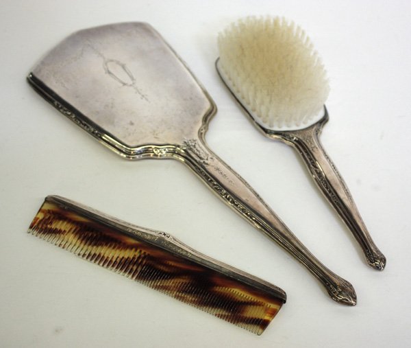 Sterling dresser set: (lot of 3) Sterling dresser set consisting of brush, comb, and hand mirror