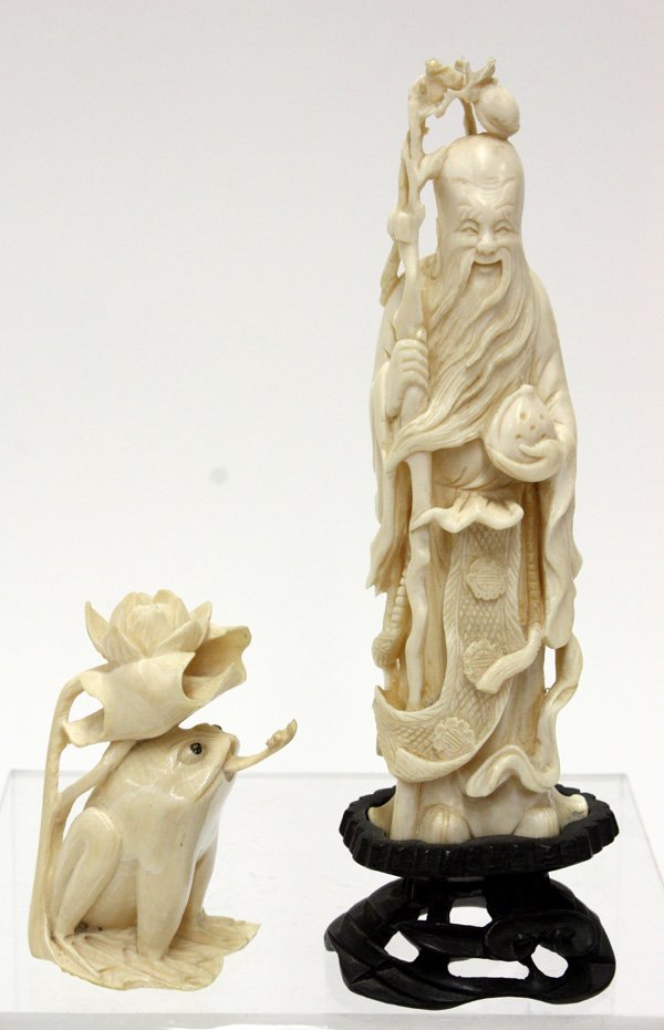 Chinese Ivory Shoulao/Frog Snuff Bottle: (lot of 2) Chinese ivory carvings, the first of Shoulao standing with a staff and holding a peach, with carved wooden stand, the second a stuff bottle in the form of a frog framed by a lily pad, the s