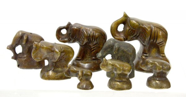 Asian Bronze Opium Weights, Elephants: (lot of 8) Southeast Asian bronze elephant-shaped 'opium' weights (actually common dealing weights), consisting of a graduated set of six together with two additional weights of similar form, tallest 