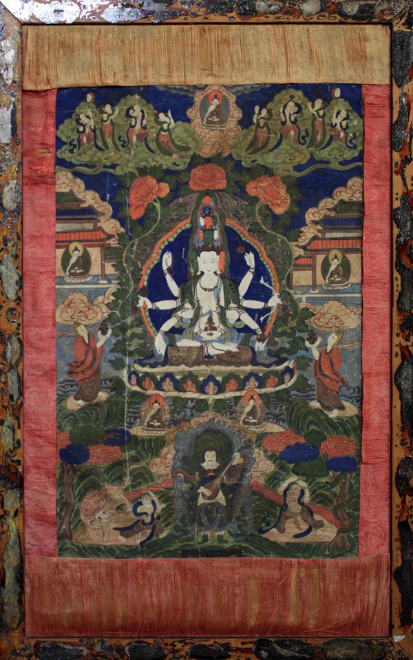 Framed Nepalese Thangka/Tanka: Framed Nepalese thangka, early 20th century, featuring the eleven-headed Avalokitesvara with five pairs of arms in the namskara mudra or holding various attributes, the bodhisattva wearing princely ra