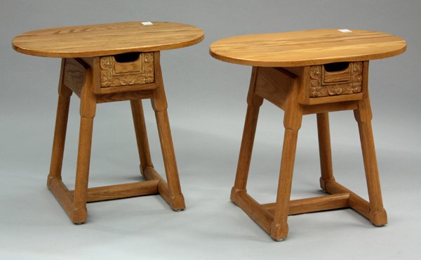 Jamestown Lounge British Oak tables: Pair of Jamestown Lounge, ''British Oak'' side tables, circa 1940, each with oval tops above a single drawer with stylized floral carving, rising on a splayed turned stretcher base, maker's brand on u