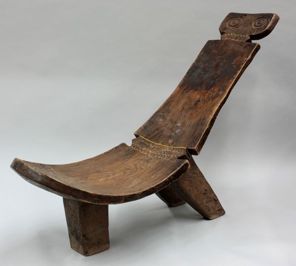 Carved wood stool, Bwa Tribe: Carved wood stool, Bwa Tribe, with mask design, on tripod base, 34''h x 54''w x 18''d