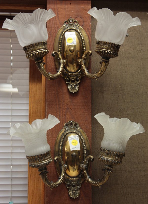 brass double wall sconces: Pair of brass mid 20th century double wall sconce light fixtures with non matching frosted shades, from the Pleasanton Hotel 17''w