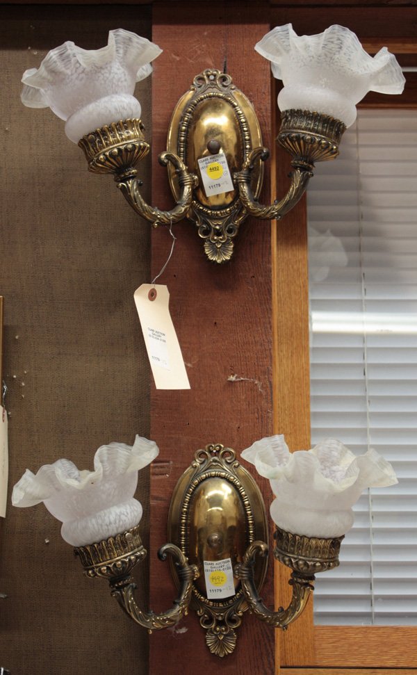 brass double wall sconces: Pair of brass mid 20th century double wall sconce light fixtures with matching frosted shades, from the Pleasanton Hotel 17''w