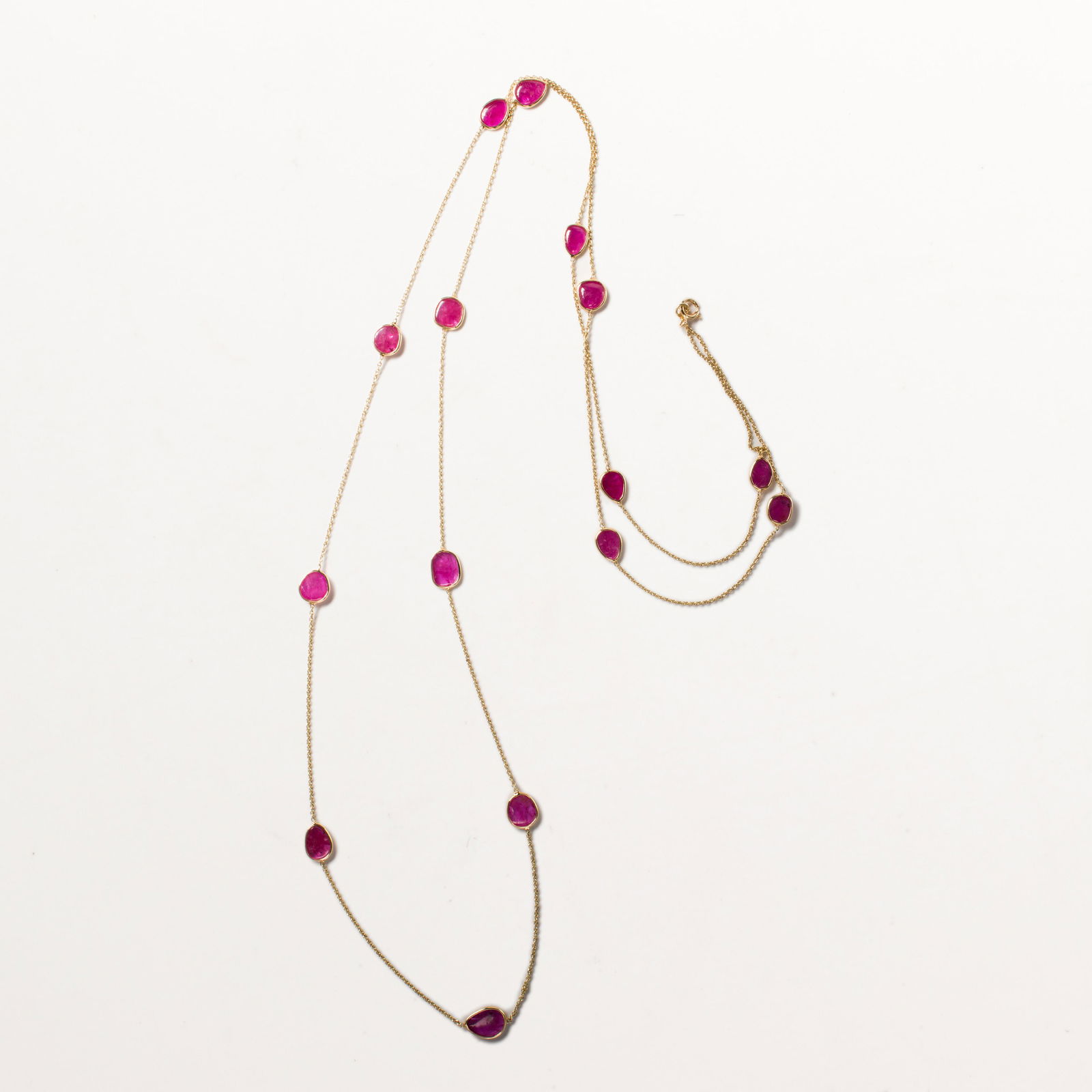 A ruby and fourteen karat gold necklace (1 of 2)
