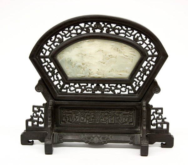 Chinese Jade Set Hardwood Table Screen: Chinese jade inset hardwood table screen, the fan shape jade plaque fronted by the carving of a scholar accompanied by a joyous child in an imaginary landscape, the reverse with a long poem followed b