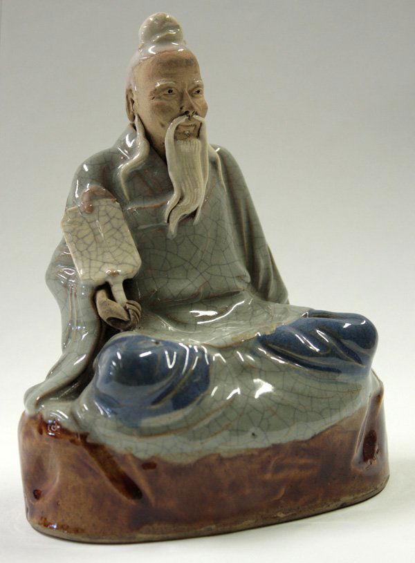 Chinese Shiwan-Style Ceramic Figure: Chinese glazed ceramic figure of an immortal, seated on a plinth with a fan in hand, the unglazed face framed by a long white beard, interior sealed 'Liu Bo [zhi] [ ]', 6.5''h