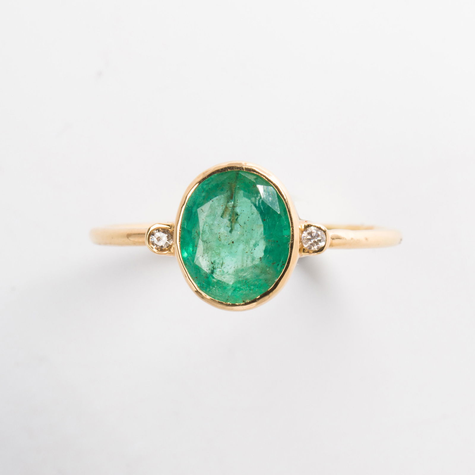 An emerald, diamond and eighteen karat gold ring (1 of 1)