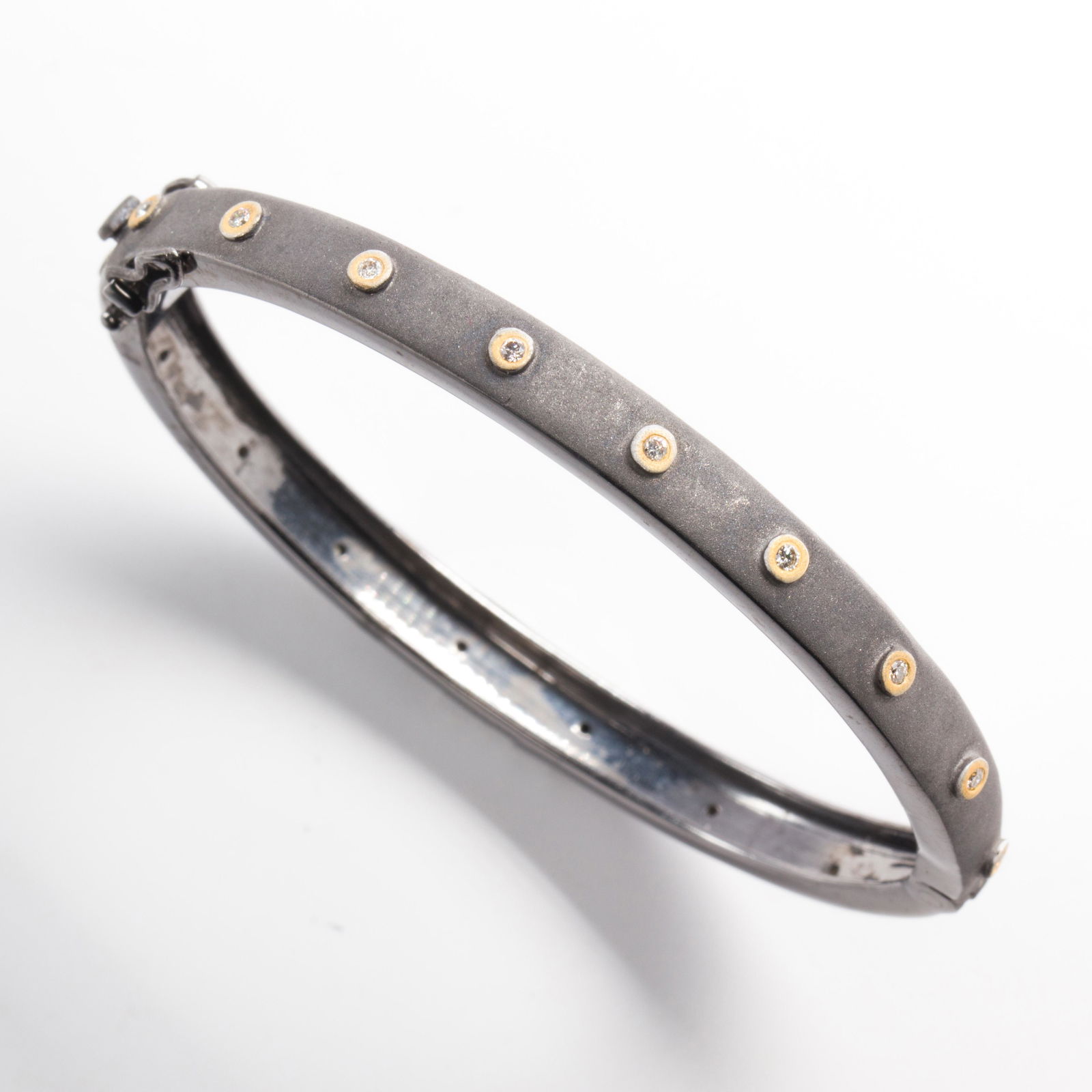 A diamond and blackened silver bangle bracelet (1 of 1)