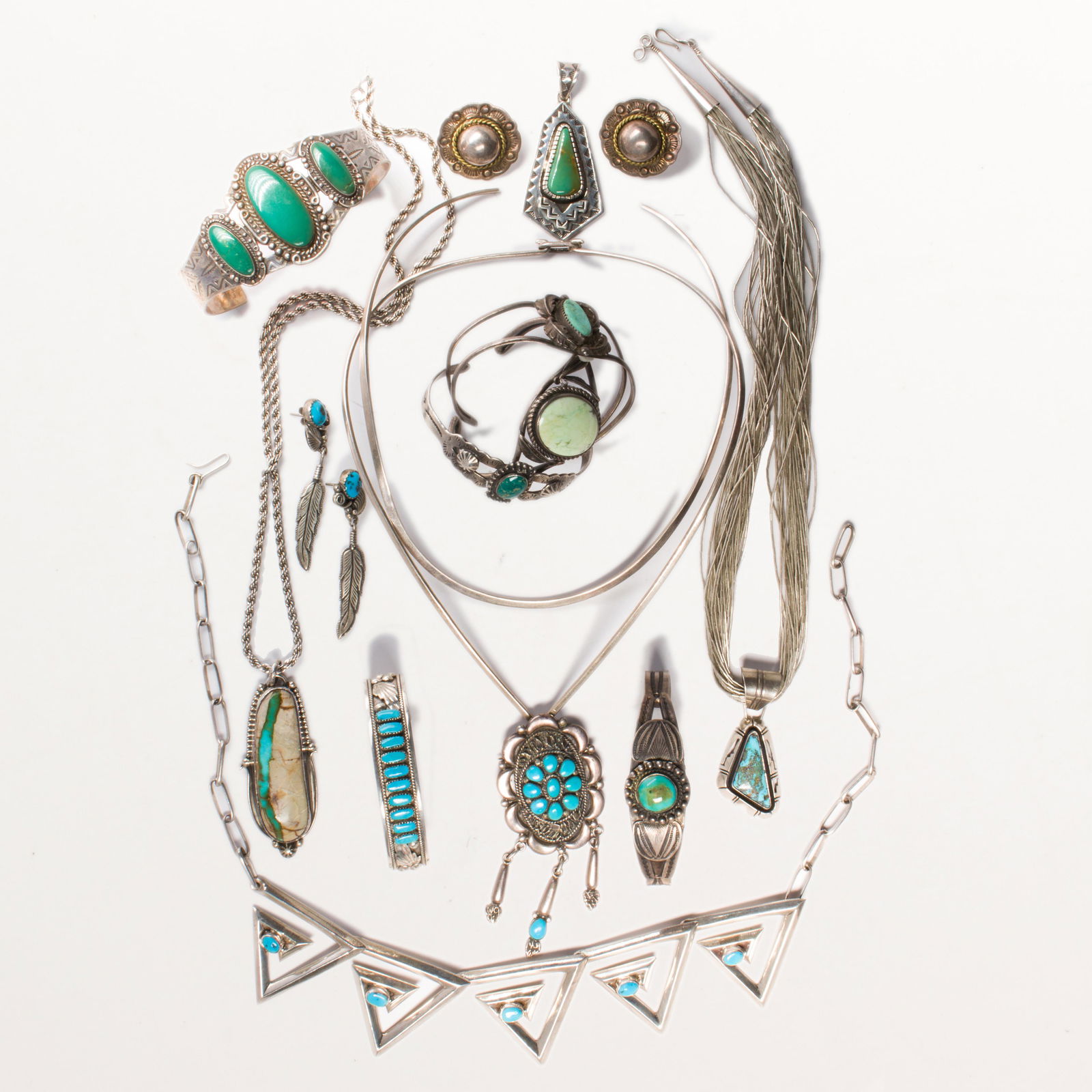 A group of American Southwest turquoise jewelry, incl.: A group of American Southwest turquoise jewelry, incl. Native Americancomprising six necklaces, seven cuff bracelets, two pairs of earring, most set with polished turquoise. 11.9 ozt