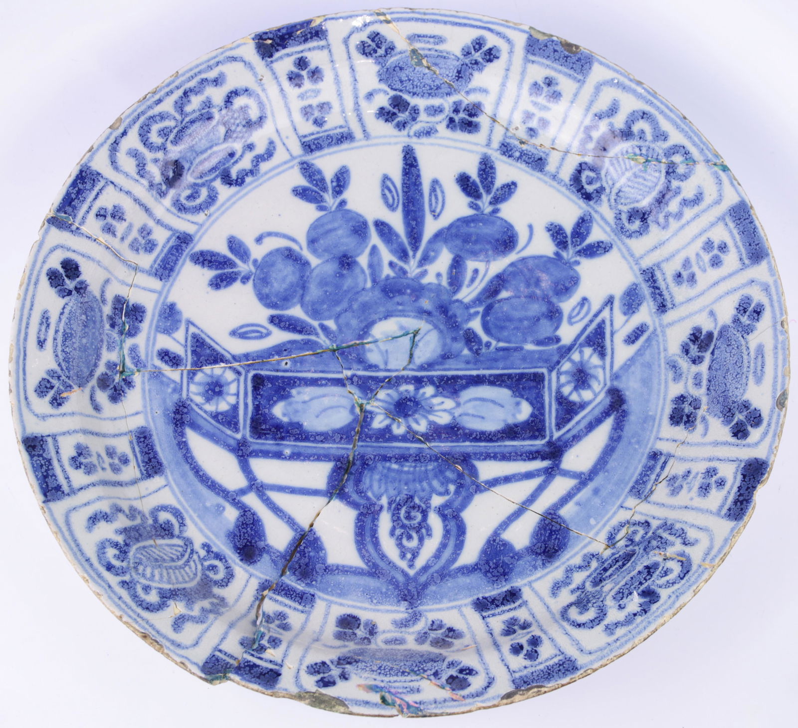 A Dutch Delft version of a Chinese Kan Hsi blue and: A Dutch Delft version of a Chinese Kan Hsi blue and white plate, 14"dia. Provenance: British Antique Dealers Show, Birmingham 1993 (note: broken and repaired '13)