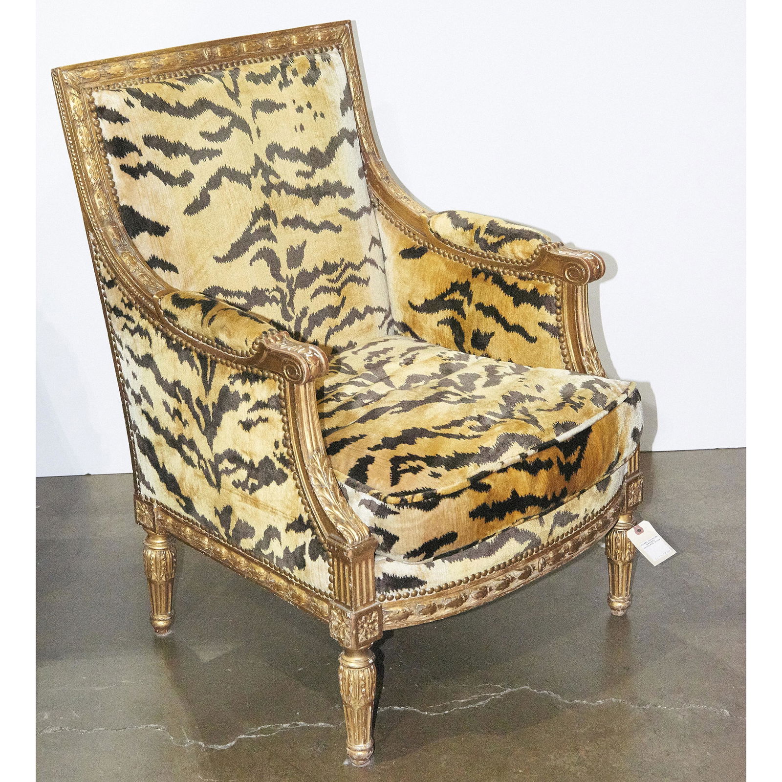 A Neoclassical style giltwood carved bergere (1 of 1)