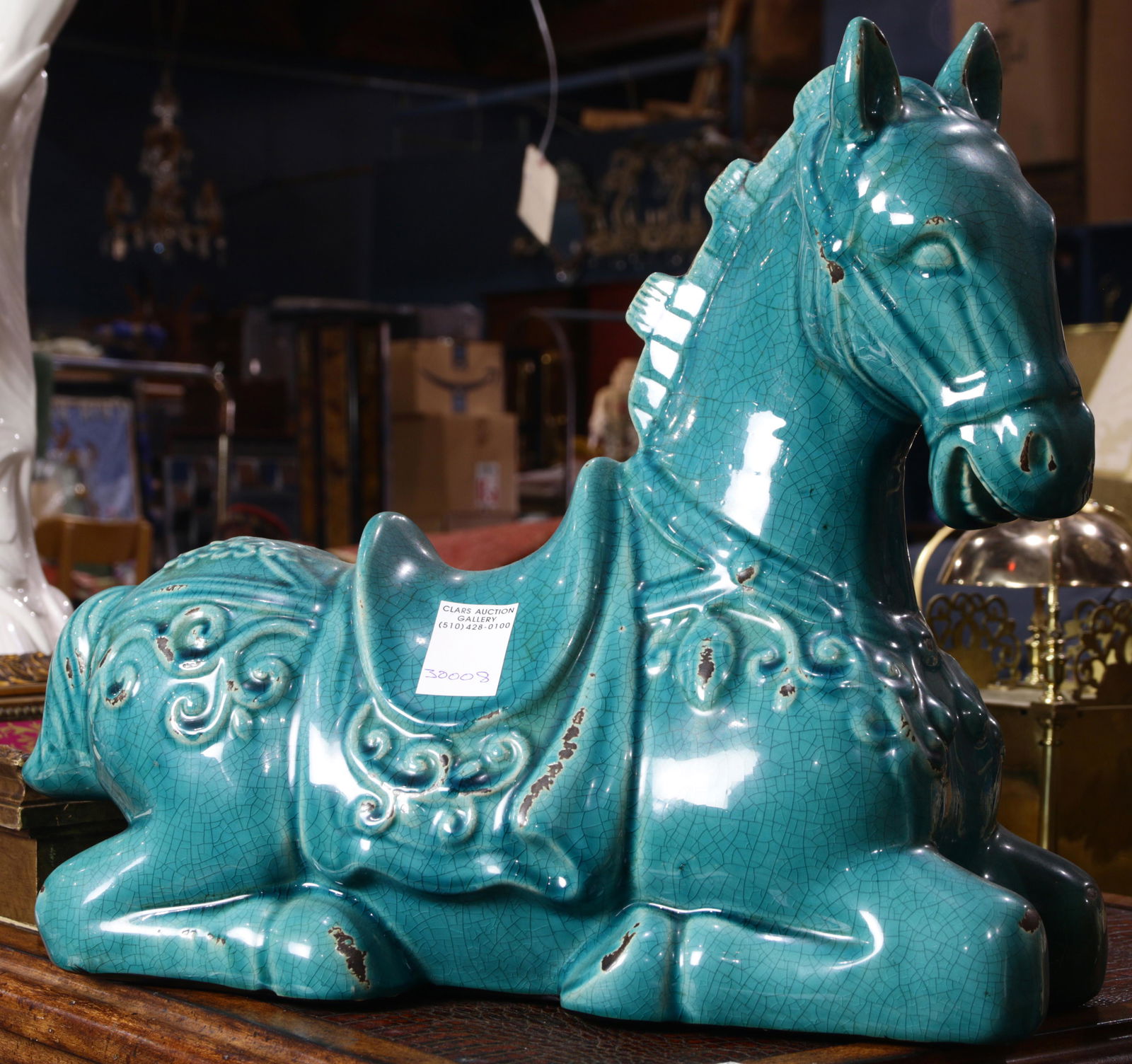 A Chinese style blue glazed seated figure of a horse (1 of 1)