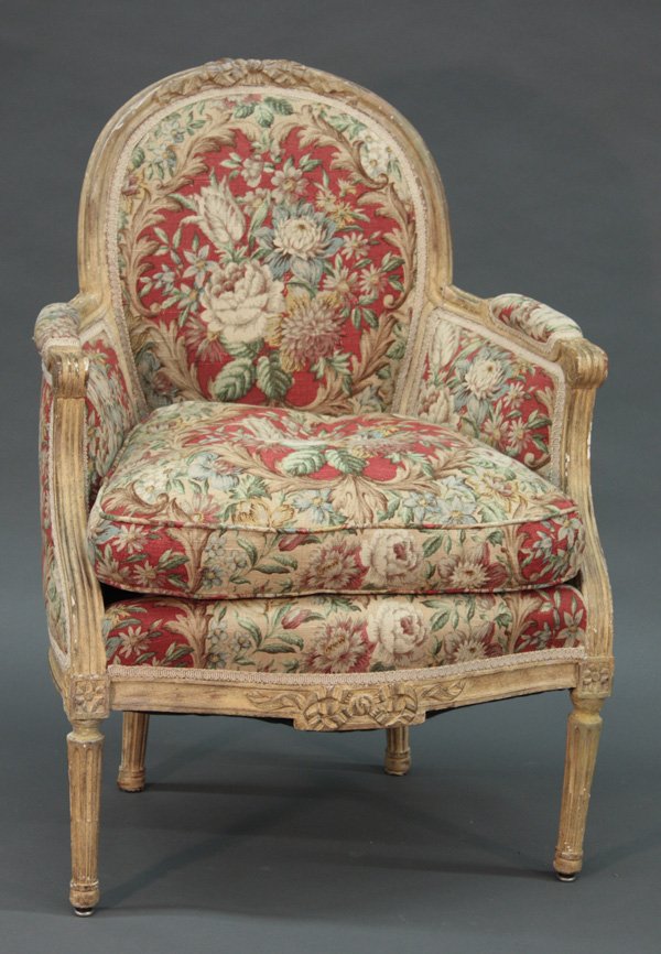 Louis XVI style bergere,: Late 19th century Louis XVI style bergere, with carved frame decorated in ivory colored paint, floral pattern upholstery, 37''h x 26''w x 26''d