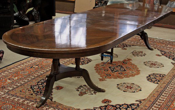 Duncan Phyfe style mahogany dining table: Duncan Phyfe style mahogany dining table with banded border, rising on a double tripod pedestal with extending center support, 29''h x 50''w x 84''l, with three-24'' leaves, 29''h x 50''w x 156''l ful