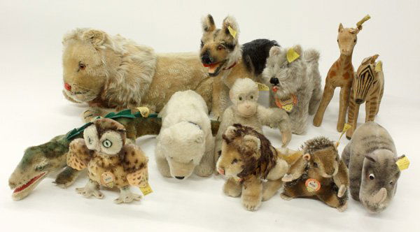 Vintage Steiff animals: (lot of 12) Vintage Steiff animals consisting of an owl, beaver, rhinoceros, zebra, 2 lions, 2 puippies, giraffe, monkey, alligator, and polar bear