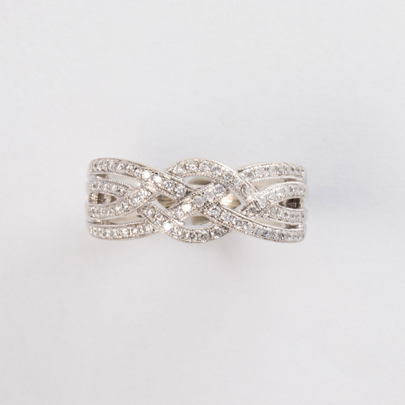 A diamond and fourteen karat white gold band ring (1 of 1)