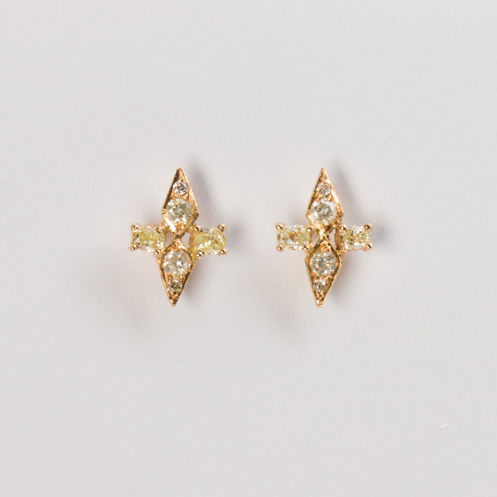 A pair of diamond and eighteen karat gold stud earrings (1 of 1)