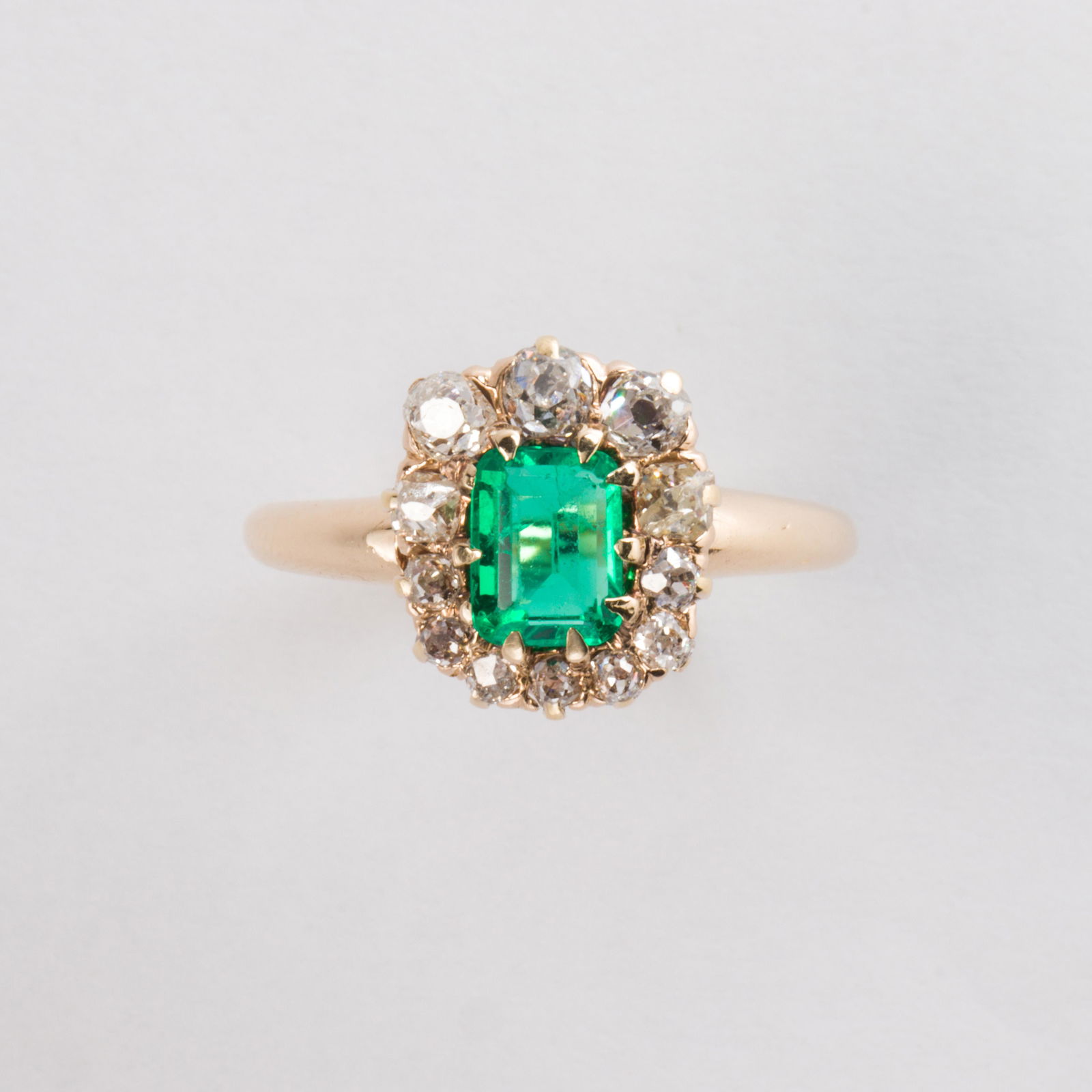 An emerald, diamond and fourteen karat gold ring (1 of 1)