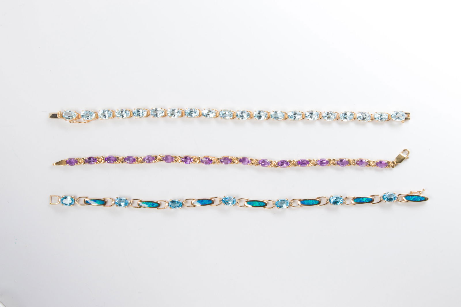 A group of gemstone and gold bracelets (1 of 1)