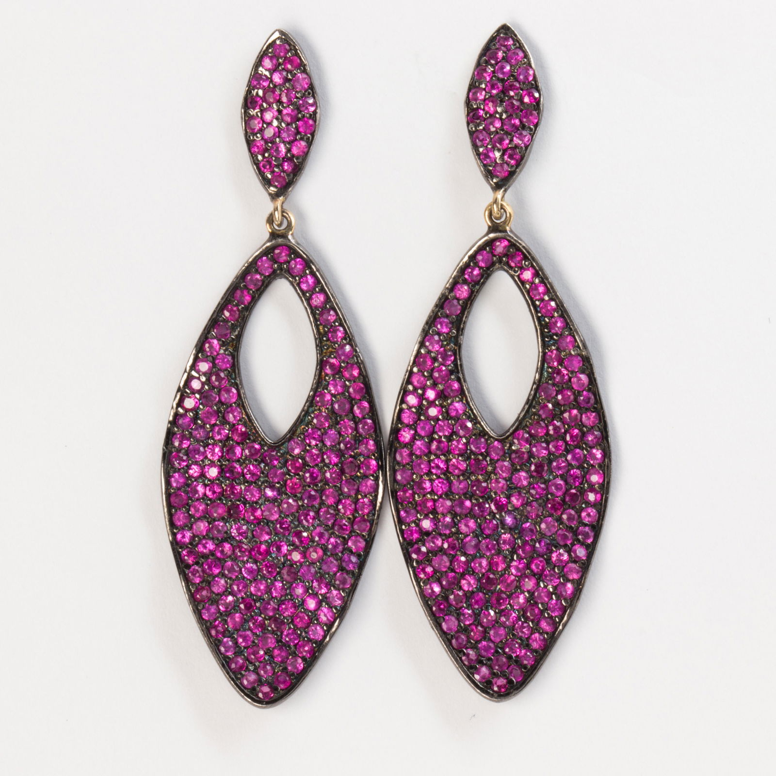 A pair of ruby and blackened sterling silver earrings (1 of 2)