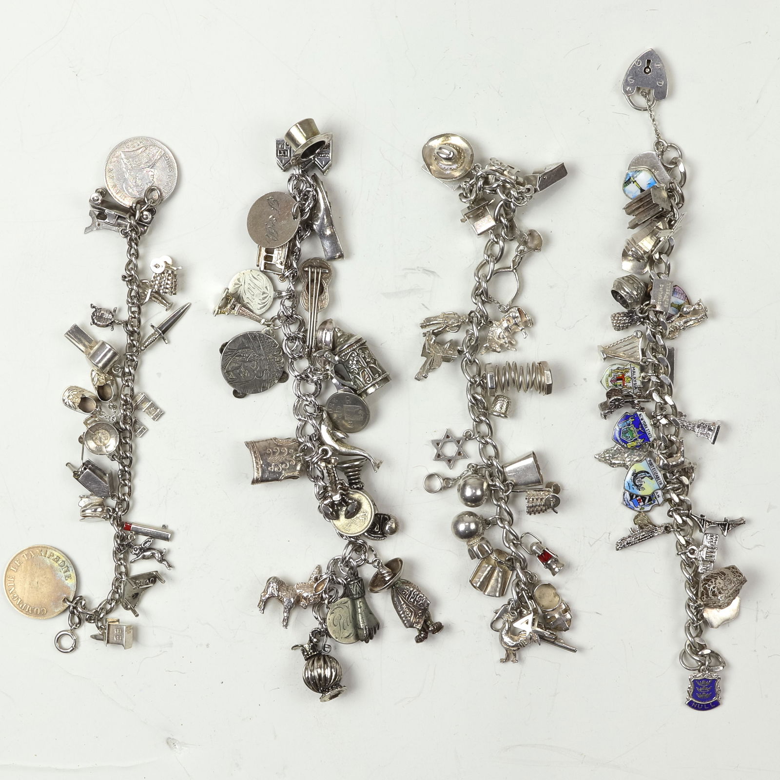 A group of silver charm bracelets (1 of 1)