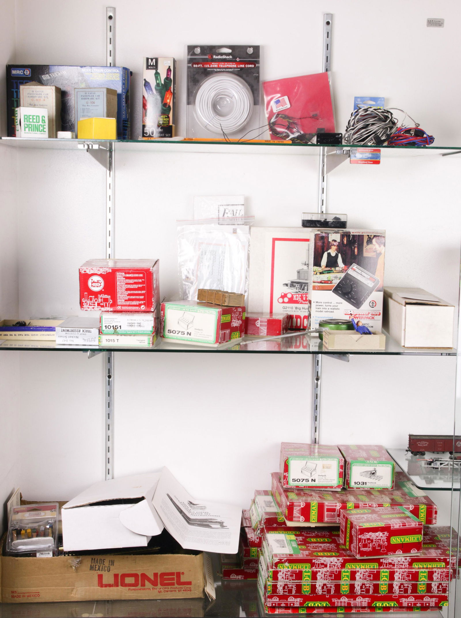 Four shelves of mainly LGB model train parts (1 of 2)