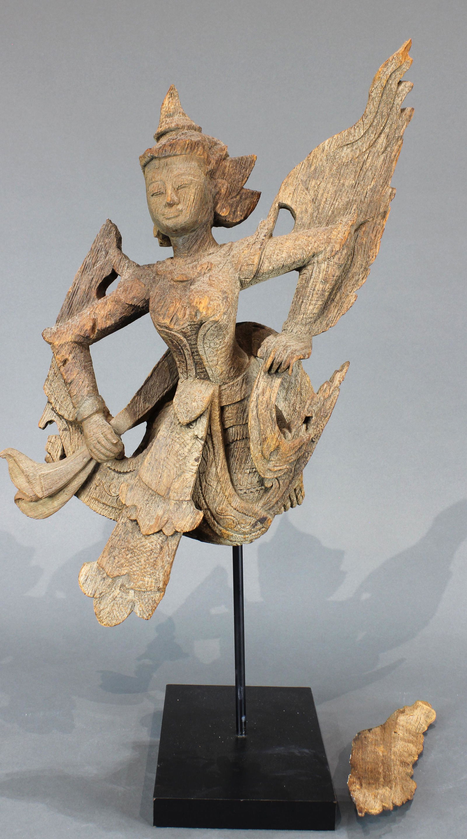 A Southeast Asian weathered wood carving of a deity (1 of 4)