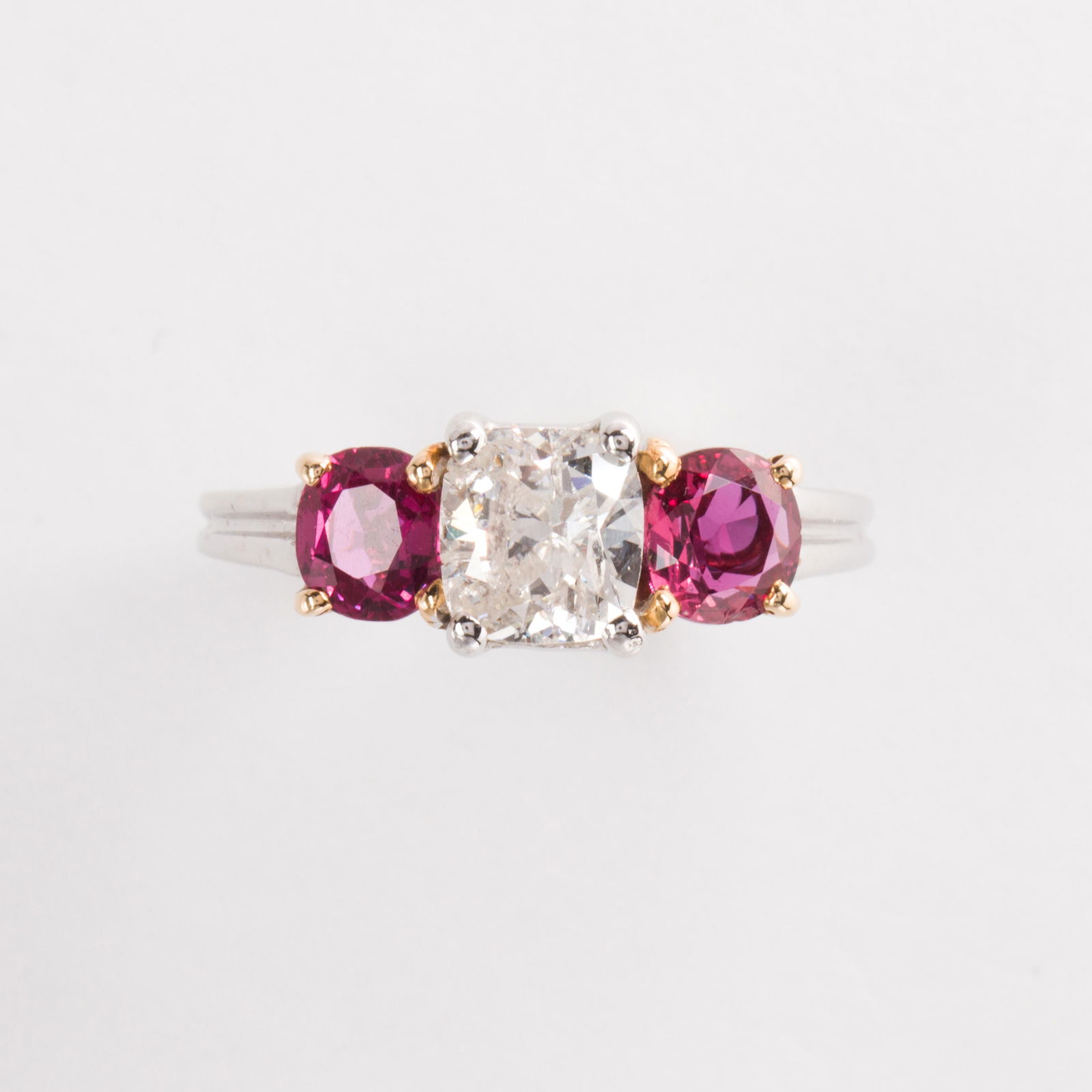 A diamond, ruby and fourteen karat white gold ring (1 of 2)