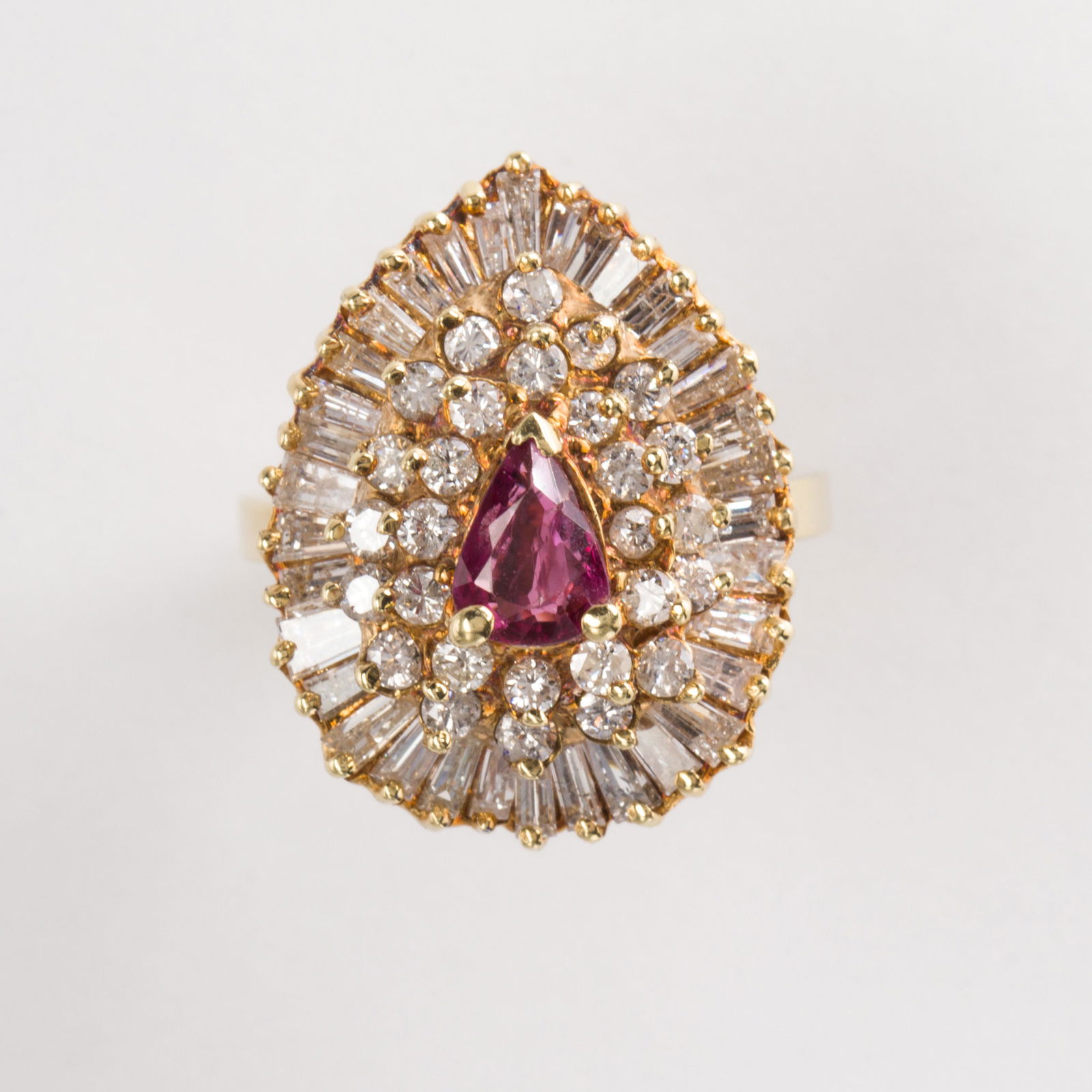 A ruby, diamond and fourteen karat gold ring (1 of 2)