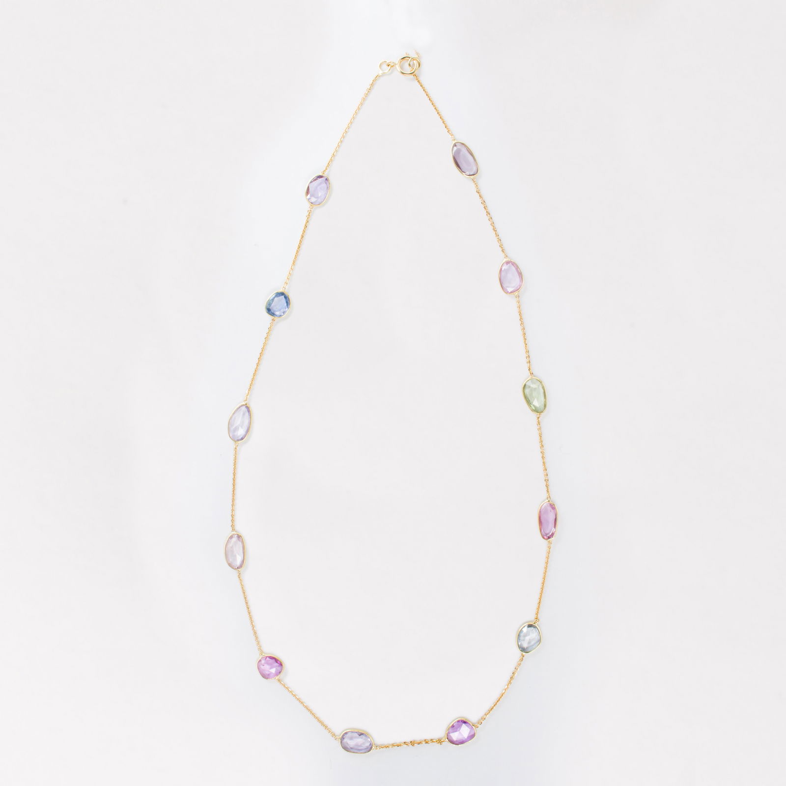 A sapphire and eighteen karat gold necklace (1 of 2)