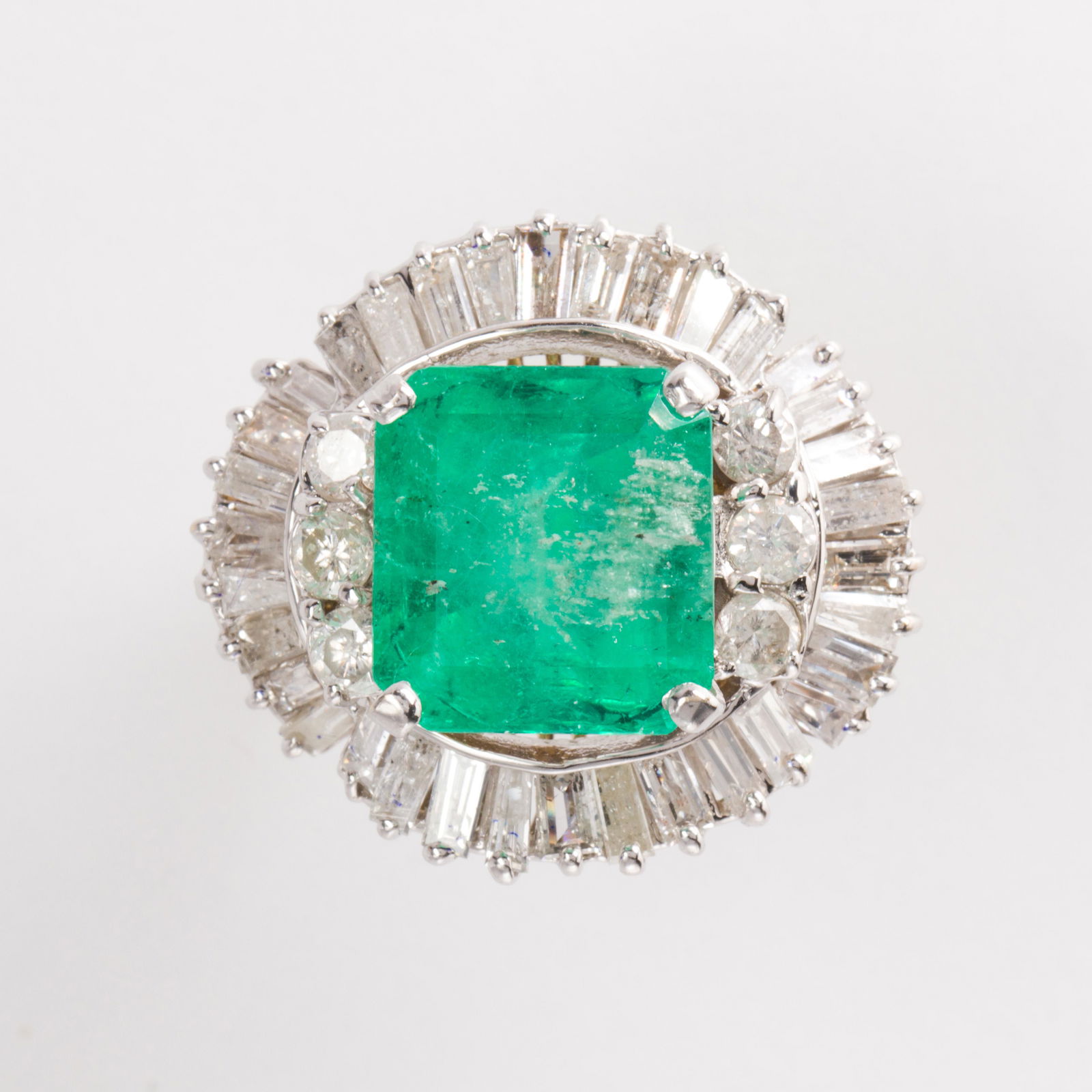An emerald, diamond and fourteen karat gold ring (1 of 2)